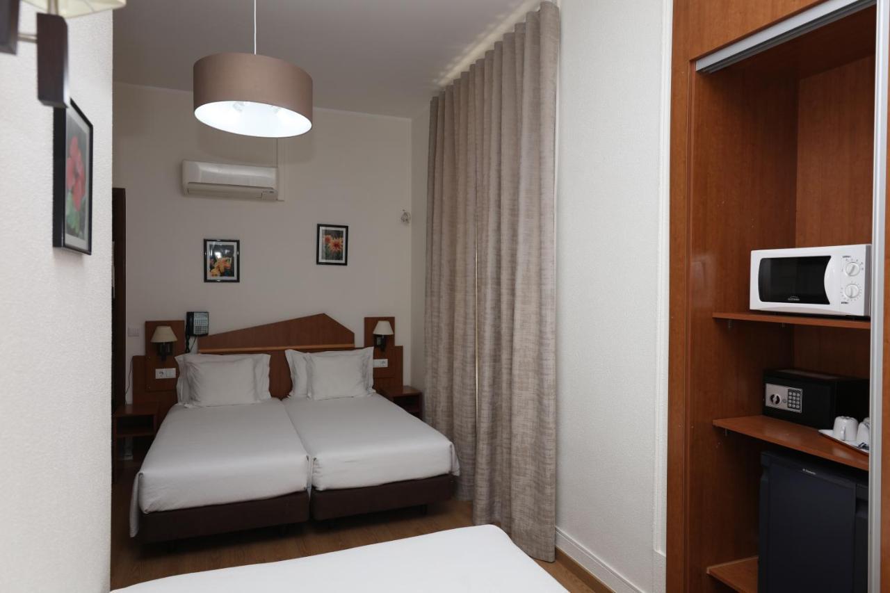 Pensao Praca Da Figueira Guest house 3*